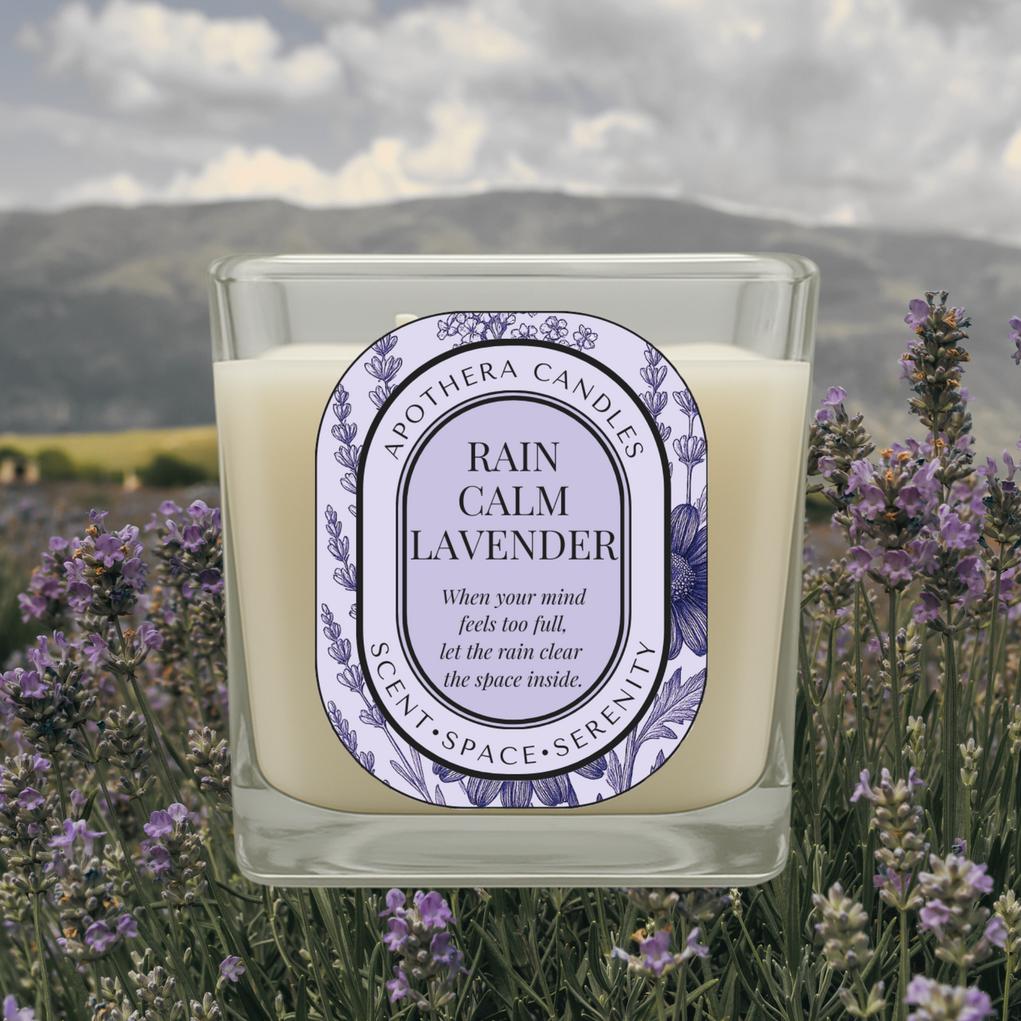 Rain Calm Lavender candle by ApoThera set in a peaceful lavender field with mountain views, evoking mental clarity, calm, and emotional stillness.